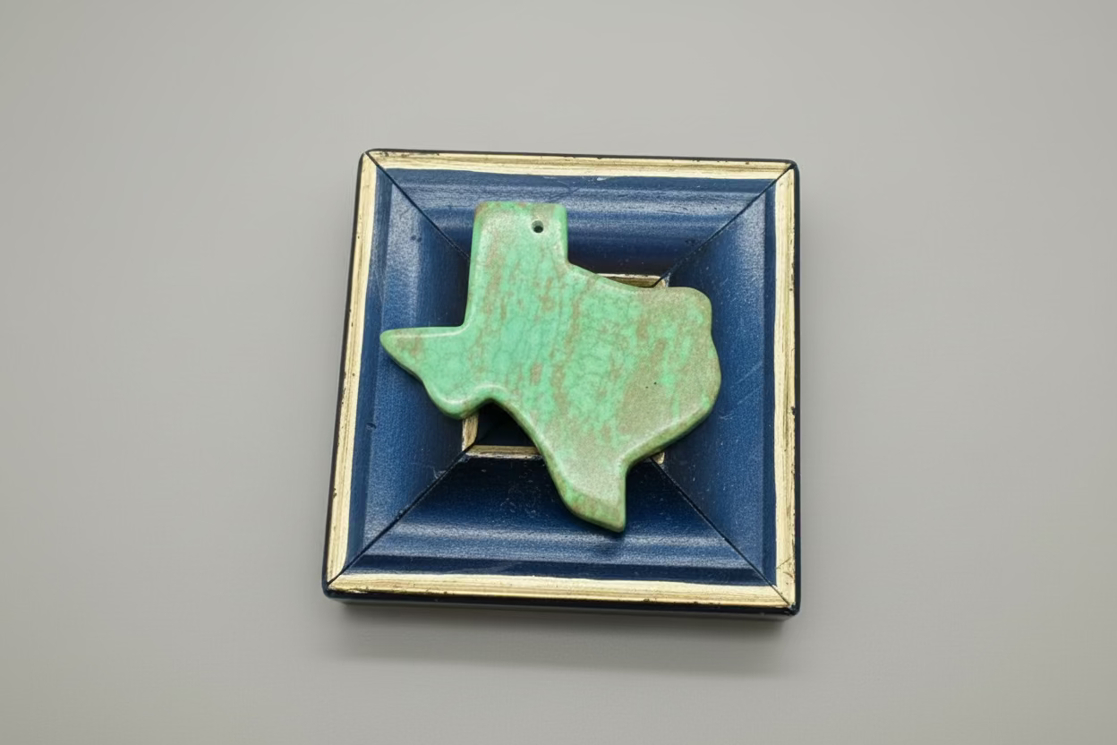 Green stone Texas-shaped art on a wooden blue frame art 
