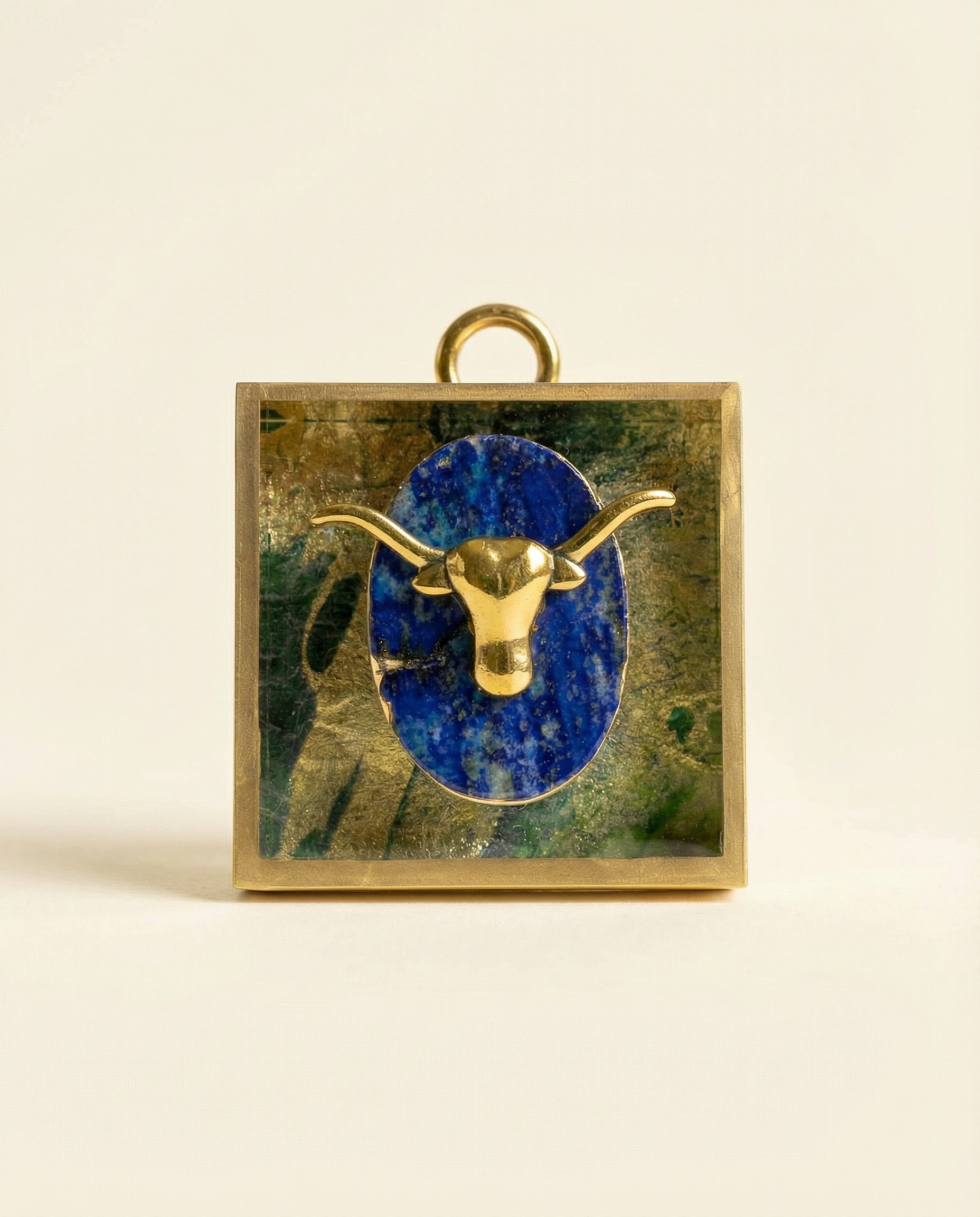Decorative art with a gold bull head on a blue lapis  on acrylic frame 