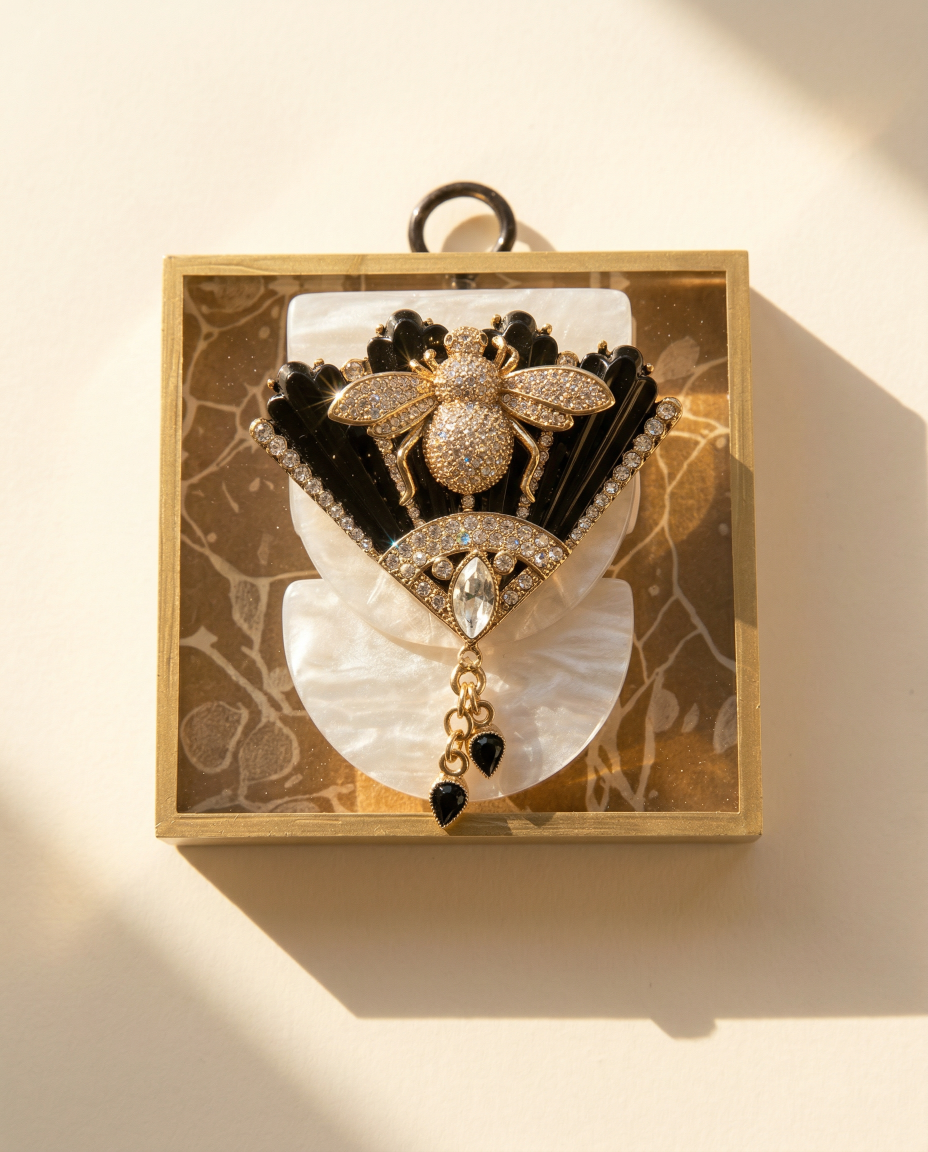 Decorative item with a gold bee design on a vintage fan brooch on acrylic frame art 