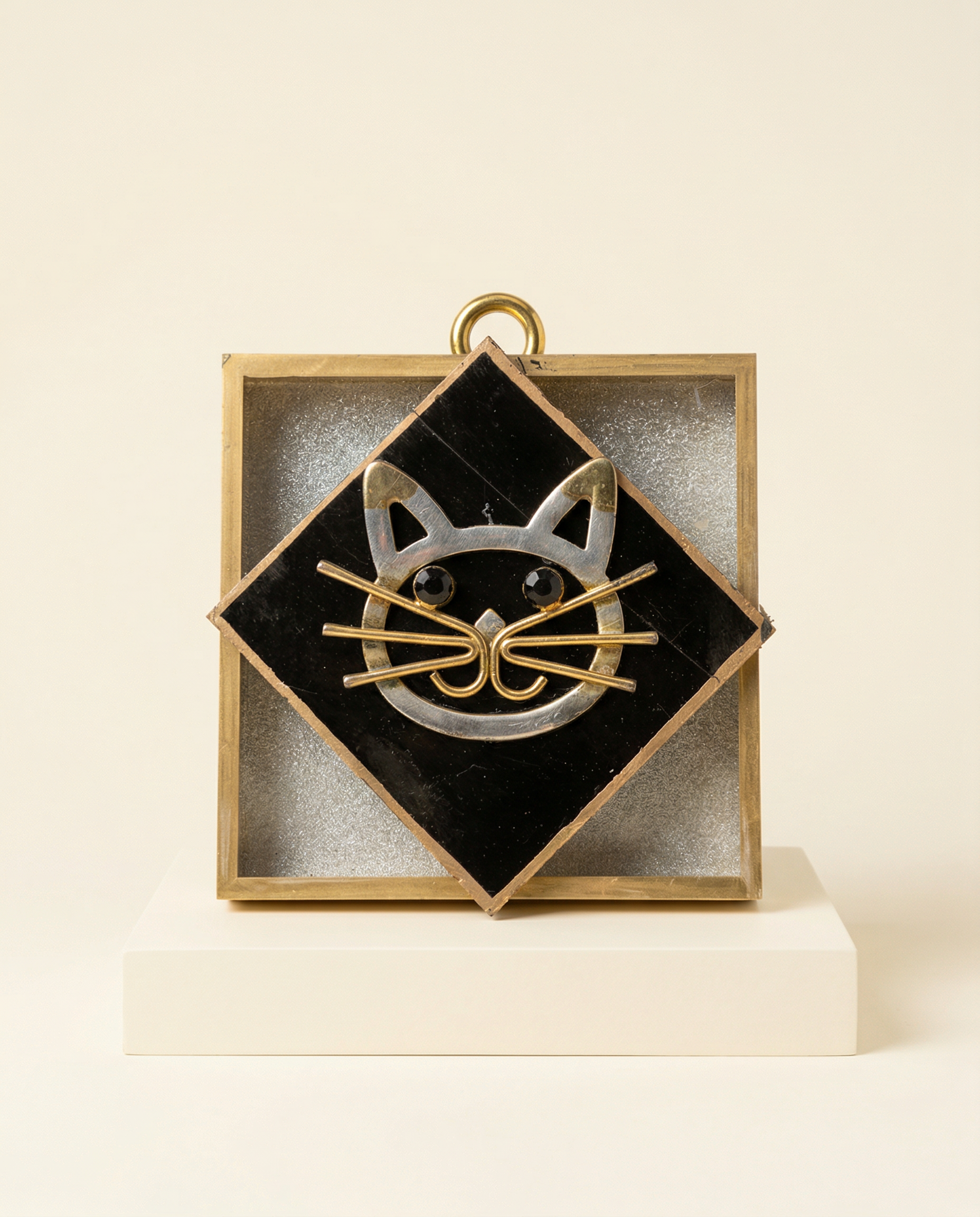 Decorative item with a cat face design on a acrylic frame art 