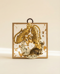 Gold leopard pendants on brooch on acrylic frame art 