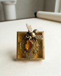 Decorative wall art with a bee on a vintage brooch art 