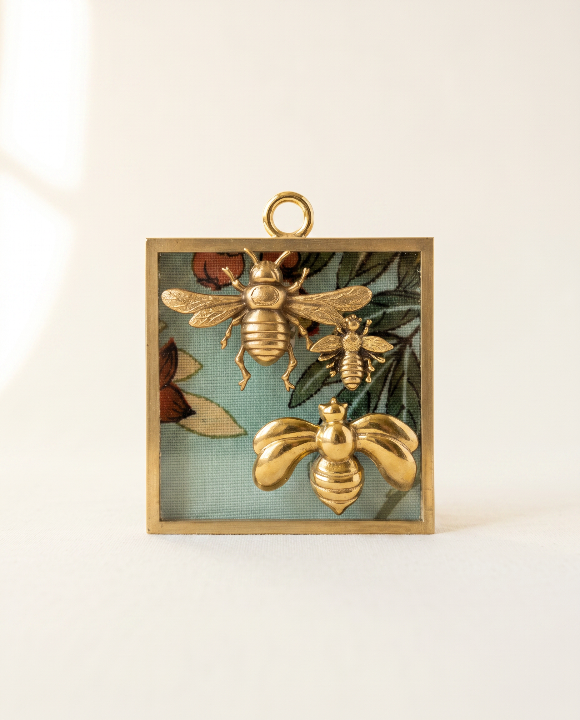 Decorative wall art with gold bees and floral elements on a fabric acrylic frame art 