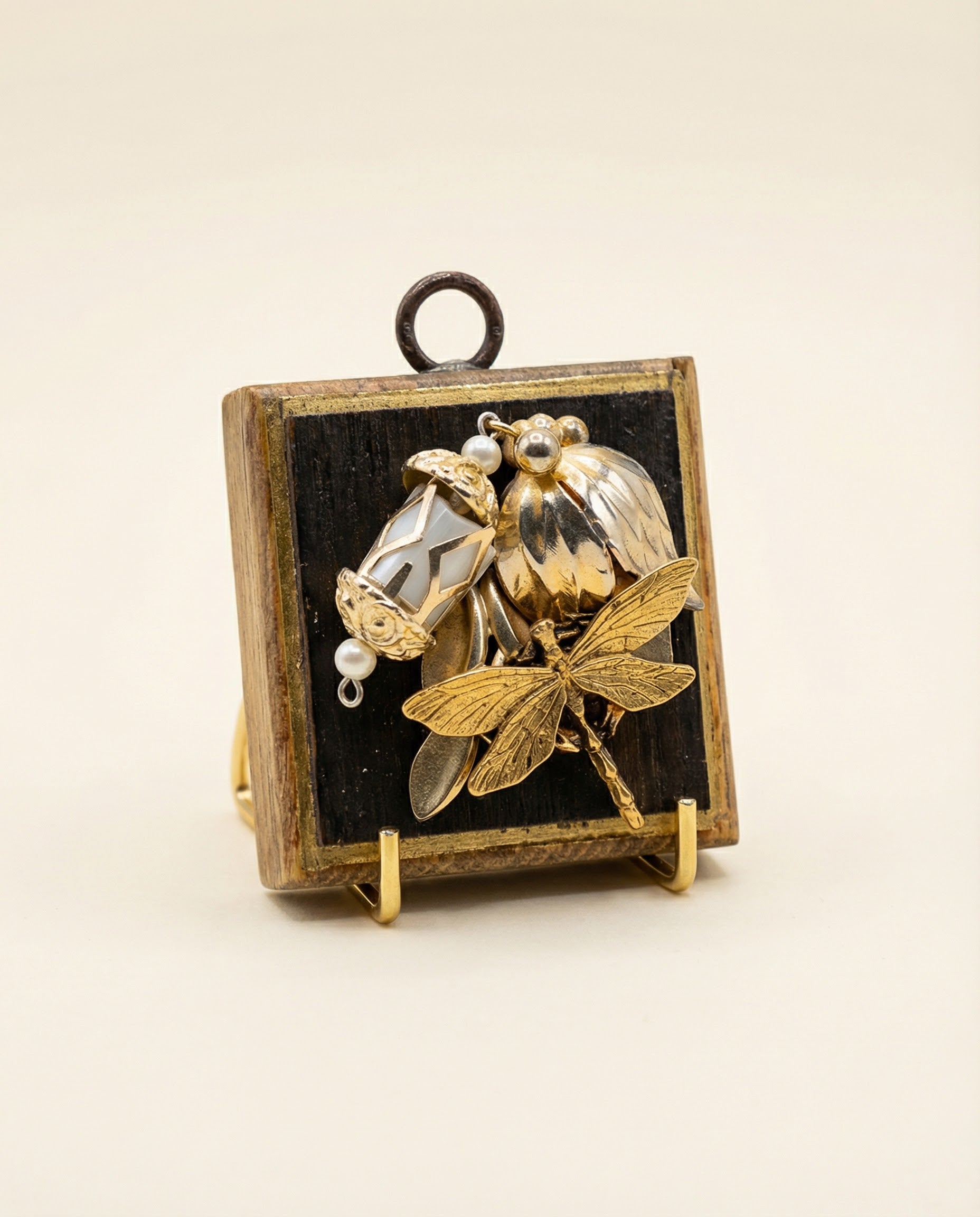Gold pendant dragonfly on vintage charms on a bourbon barrel frame art 