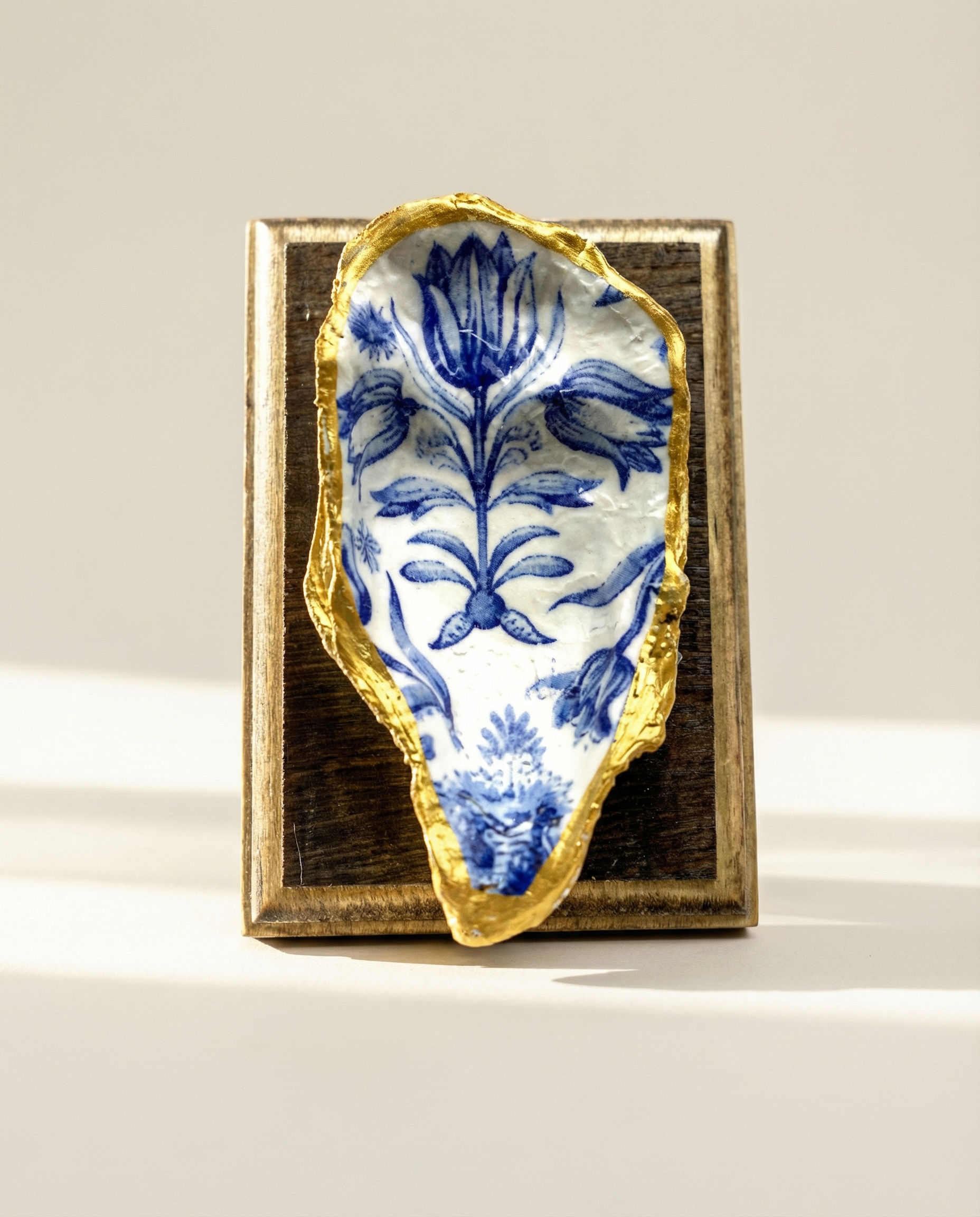 Oyster shell art on wooden bourbon barrel frame 