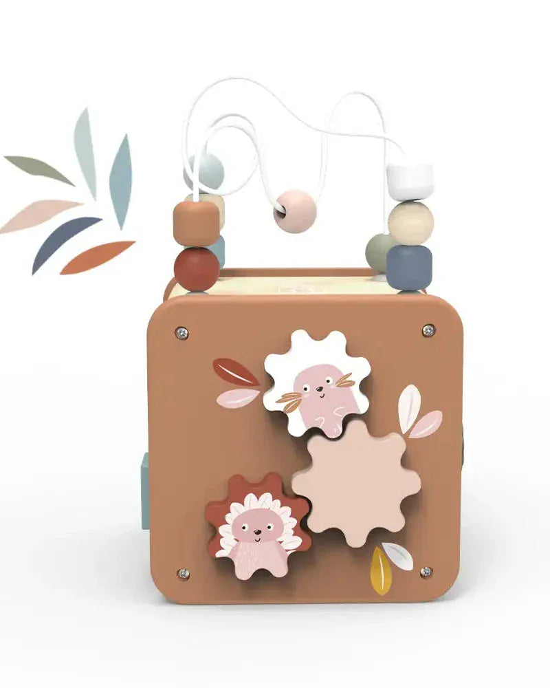 Wooden toy with floral designs and beads on a white background