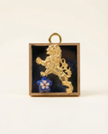 Gold lion emblem with a blue flower in a gold frame on acrylic art 