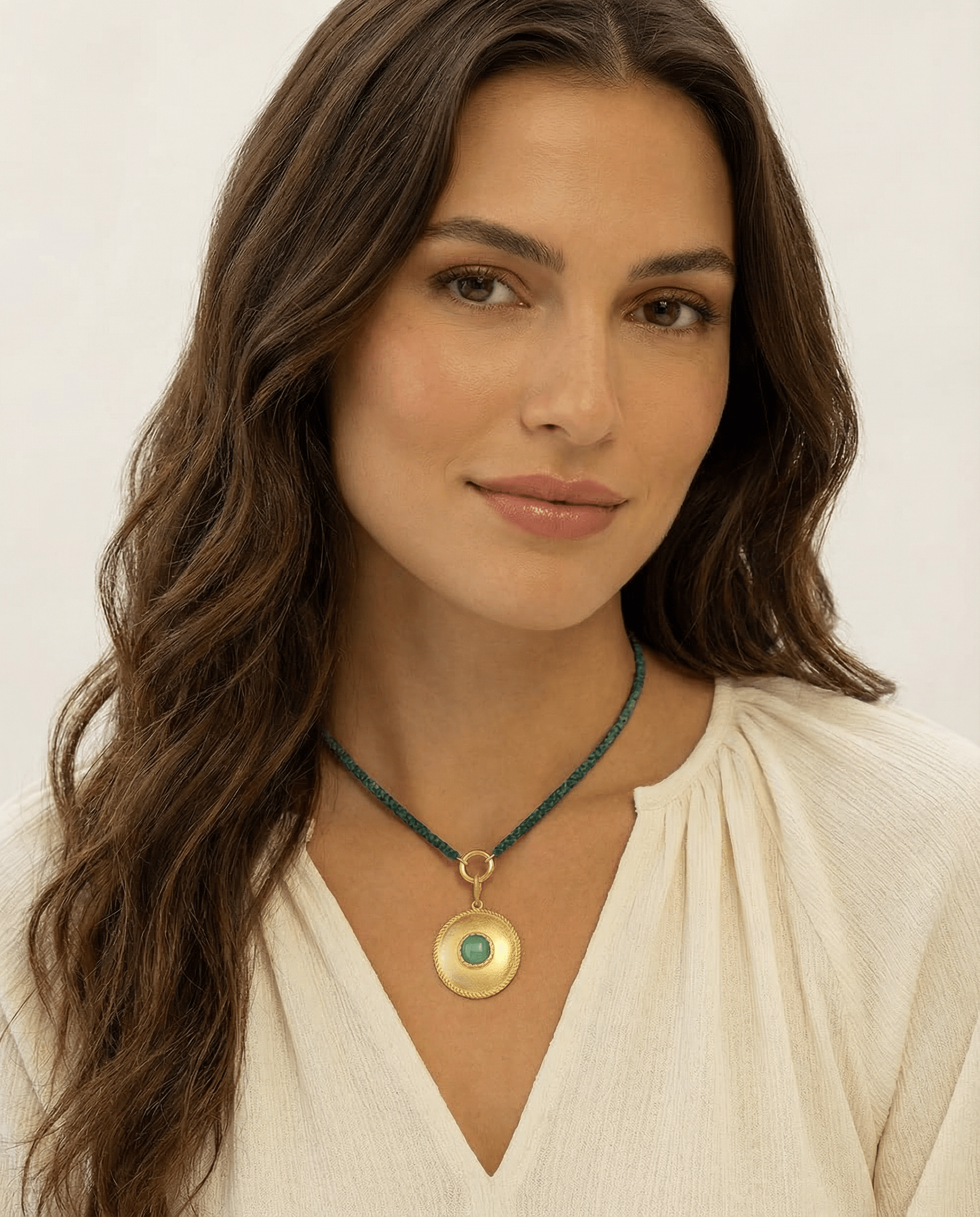 model wearing emerald green beaded necklace