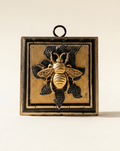 Decorative wall art with a bee design on sparkle brooch coromandel frame art