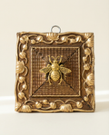 Decorative wall art with a bee design on a gold painted vintage frame 