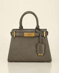 Olive Green handbag with gold accents on a beige background