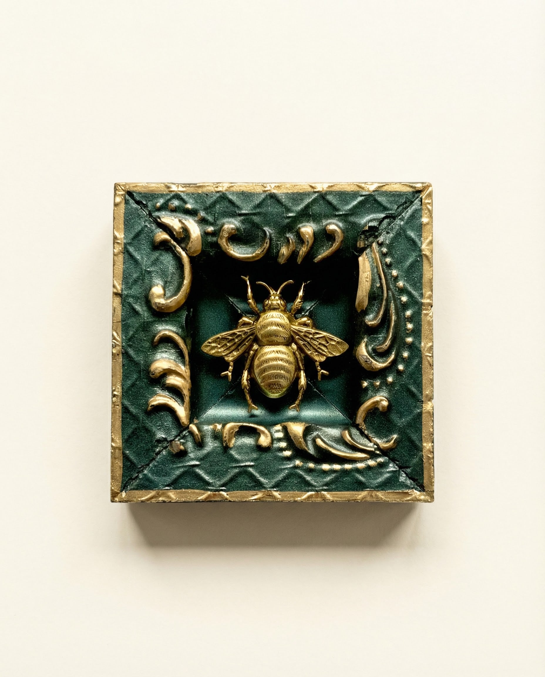 Decorative wall art with a bee design on a green painted frame with gold detail art 