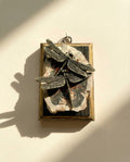 Decorative item with dragonfly design on a petrified wood art