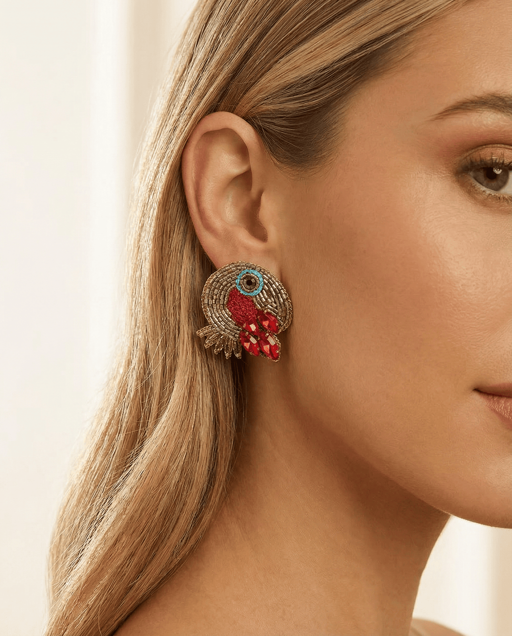 beaded toucan earrings on a model