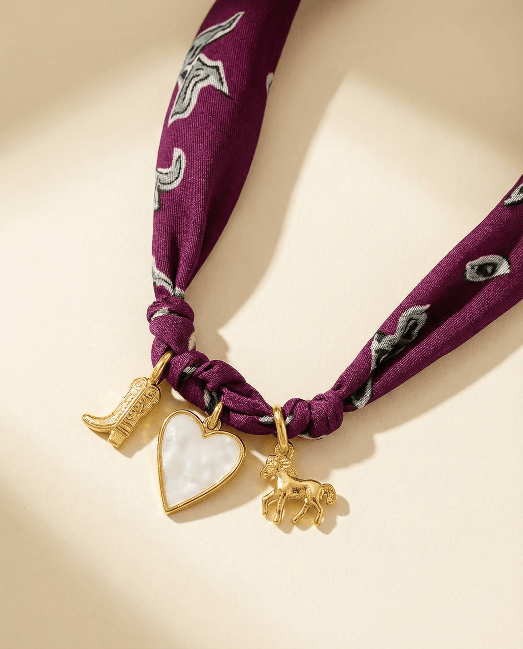three charm scarf necklace with a boot, heart and horse charm