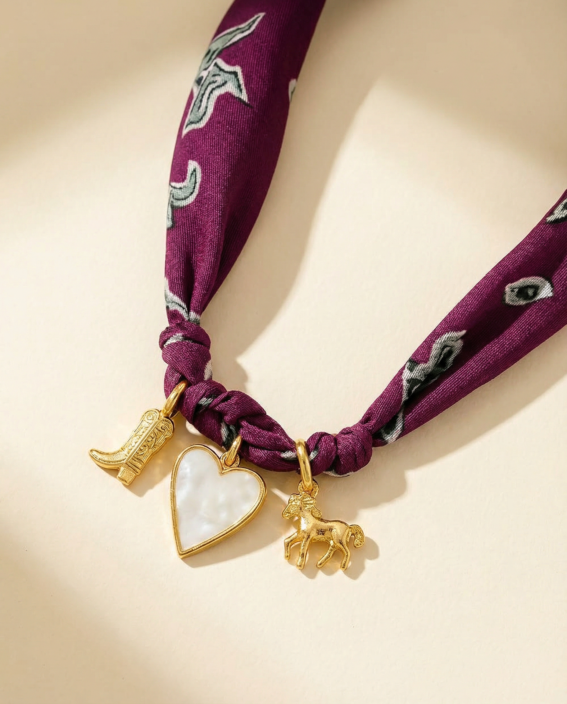 three charm scarf necklace with a boot, heart and horse charm