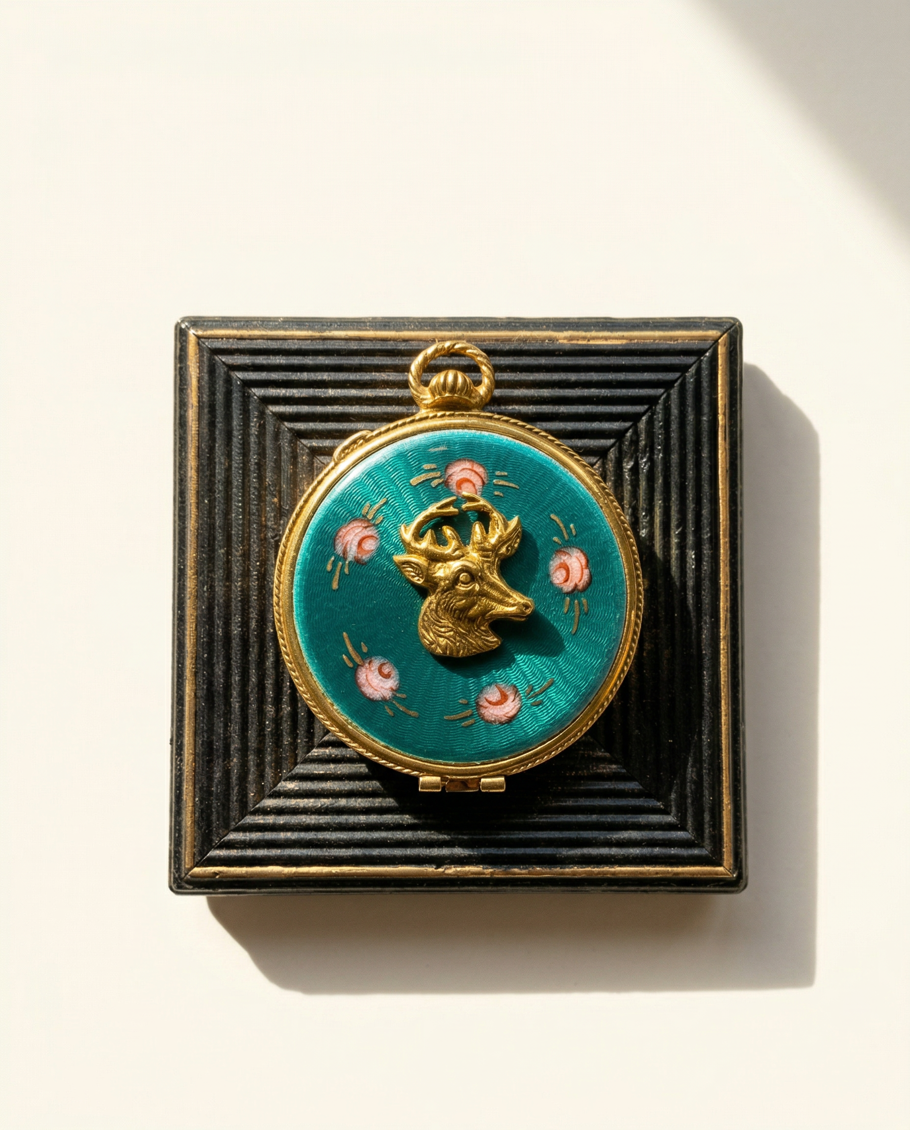 Decorative vintage compact with floral design on a textured black background art 